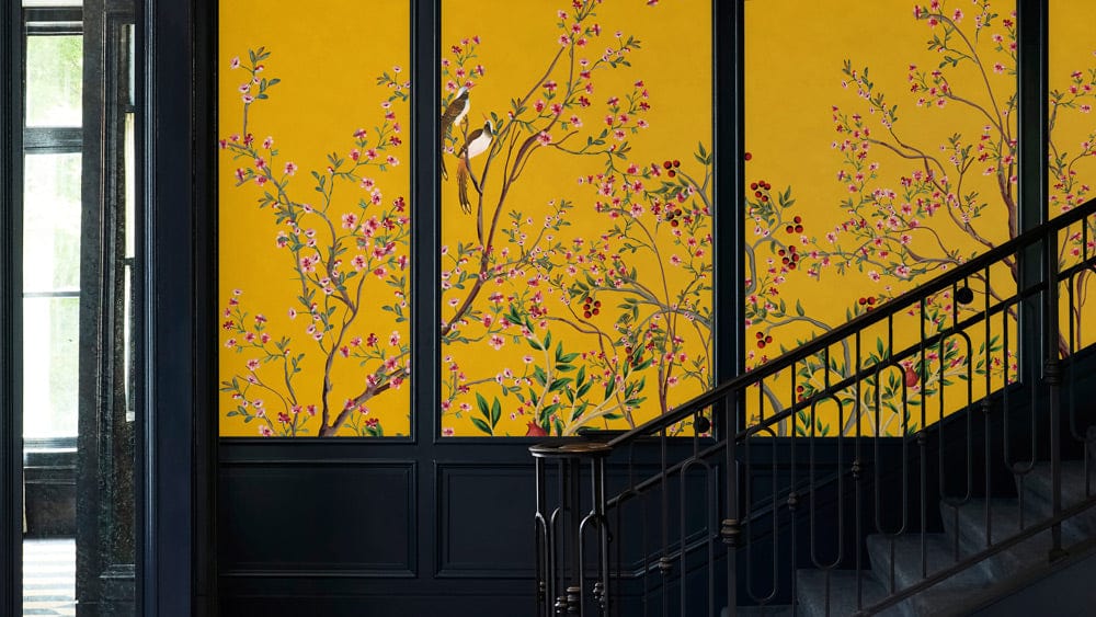 a pomegranate tree and a bird on a yellow background are featured in this handcrafted classic hallway wallpaper mural.