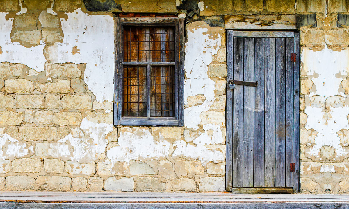 Wallpaper mural depicting old windows and doors