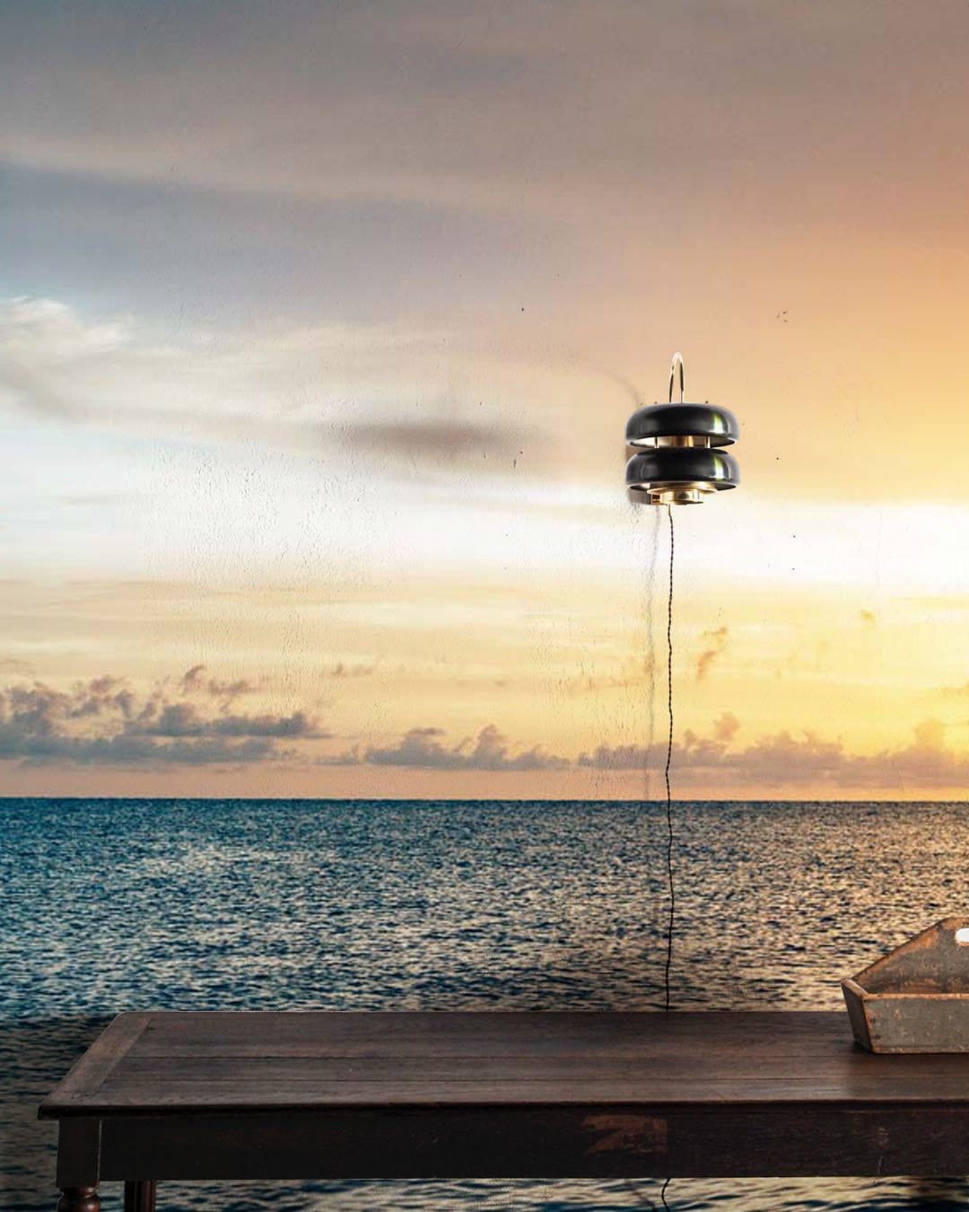 Wallpaper mural depicting a setting sun over the water in the evening