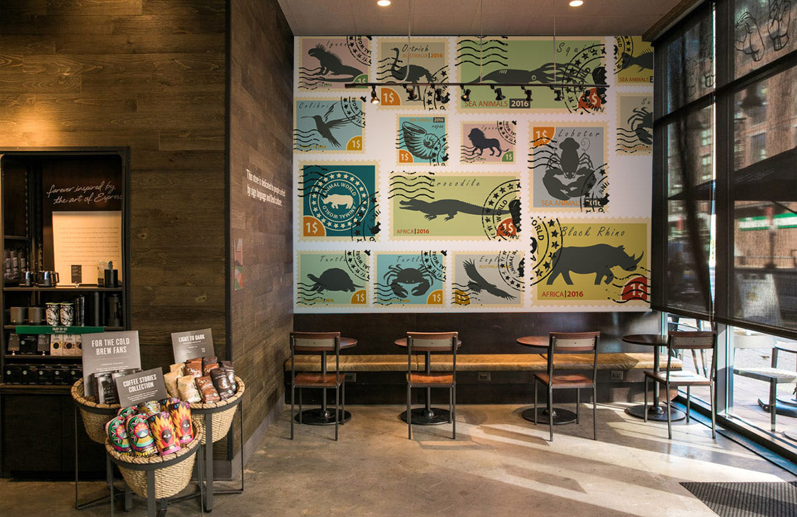 Vintage Animal Stamp Collection Mural Wallpaper in coffee shop.