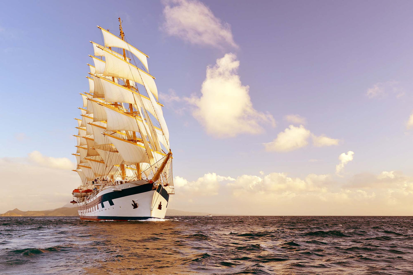 Wallpaper mural in the living room featuring a sailboat and the sky
