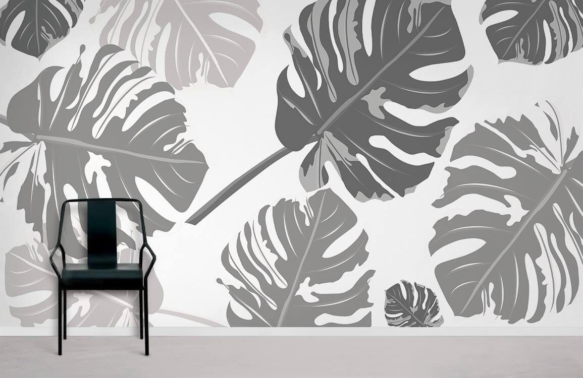 Wallpaper with a repeating pattern of large grey leaves, used for home decoration