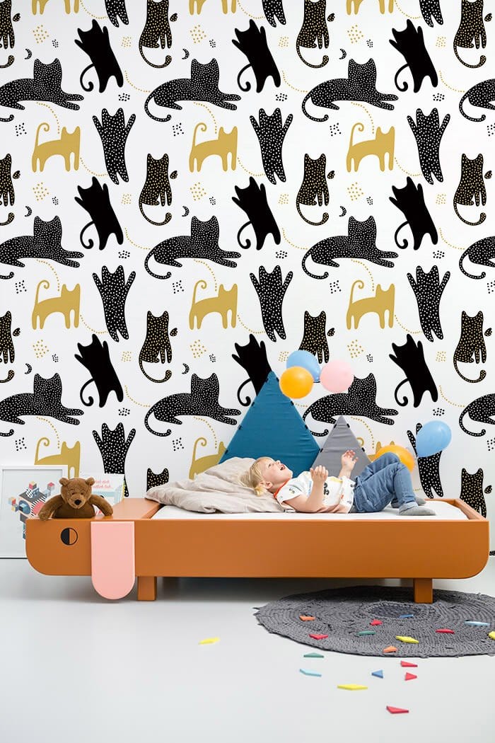 Whimsical Cat Pattern Playful Mural Wallpaper in bedroom