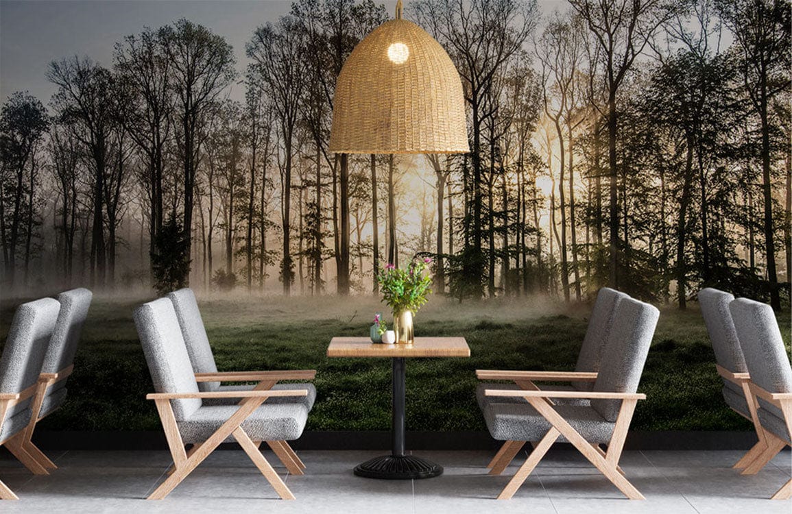 A dining room has a wall mural of a misty forest at dawn