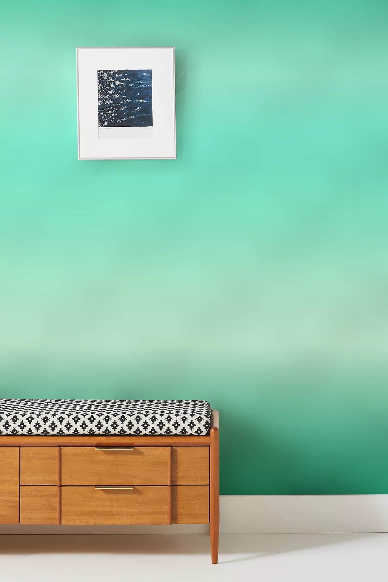 Wallpaper mural with a green gradient design for the hallway's decor