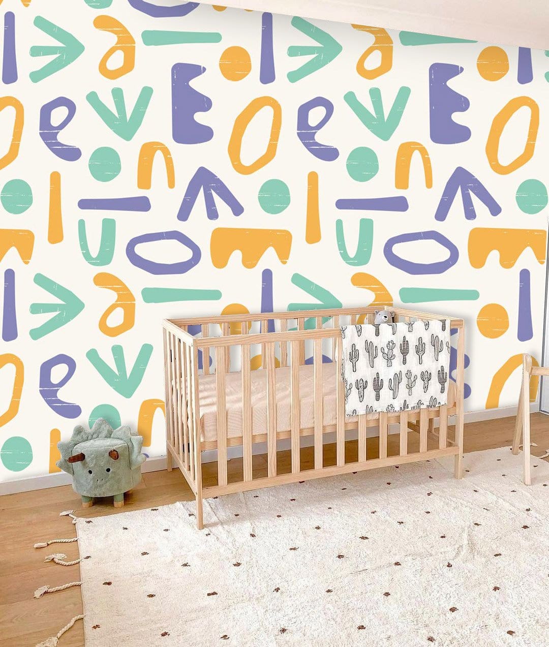 Wallpaper mural with a colourful letters pattern for use as decoration in the bedroom