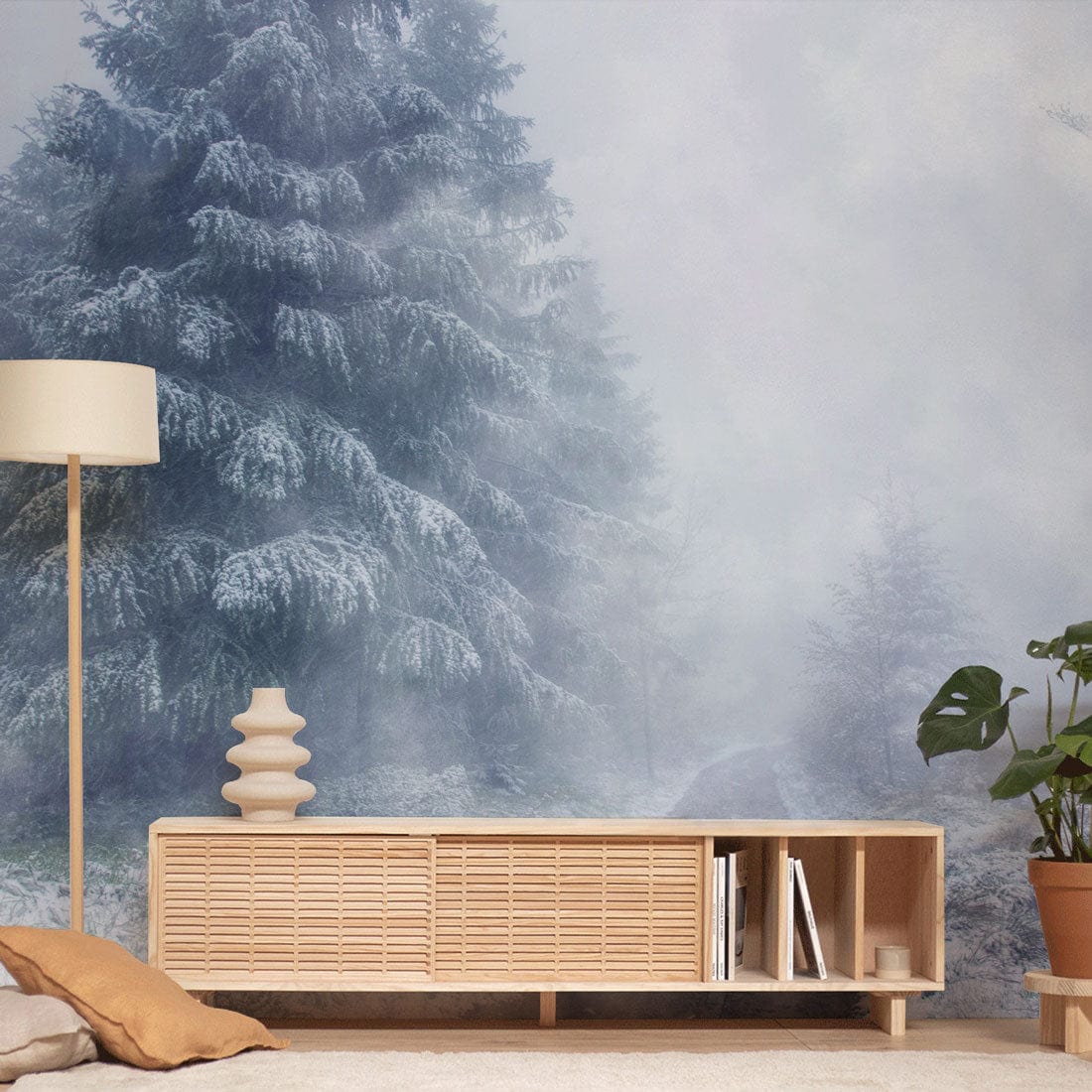 The corridor is decorated with a mural of a dense, misty winter landscape