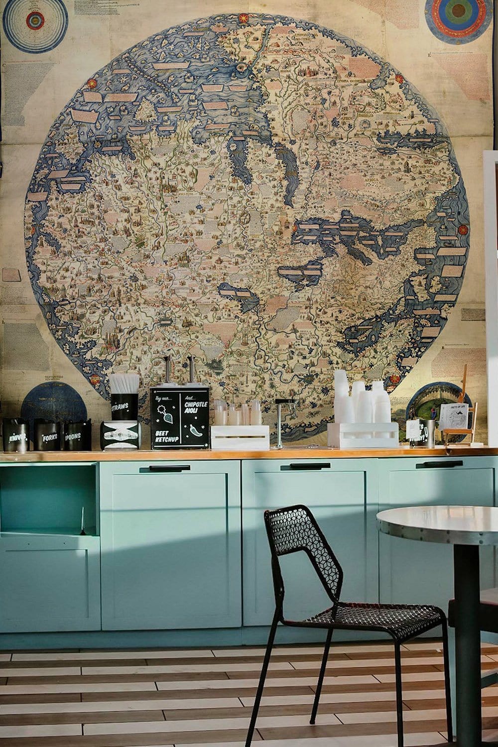 Vintage Ancient World Map Mural Wallpaper in restaurant setting