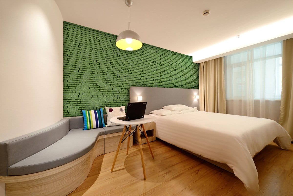 Emerald Green Brick Effect Mural Wallpaper in bedroom