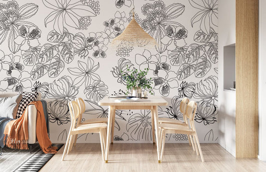 Monochrome botanical floral wallpaper in stylish dining area with light wood furniture and beige flooring.
