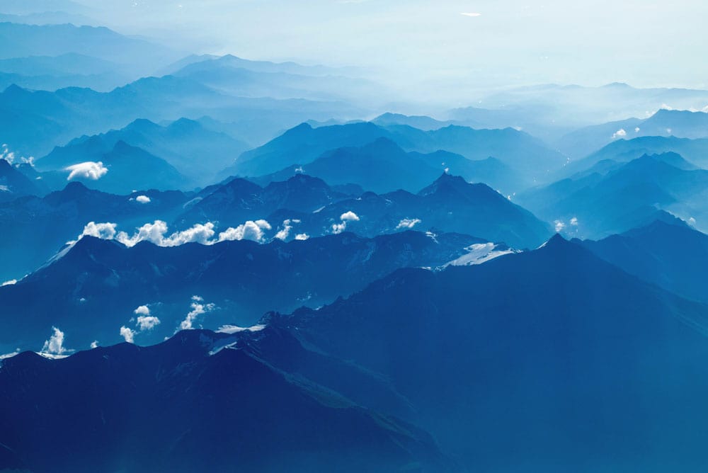 Wallpaper mural with a dark blue mountain range, perfect for home decor.