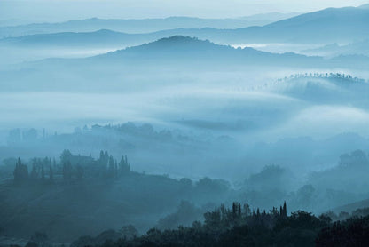 Wallpaper mural featuring hazy rolling mountains for use in home decoration