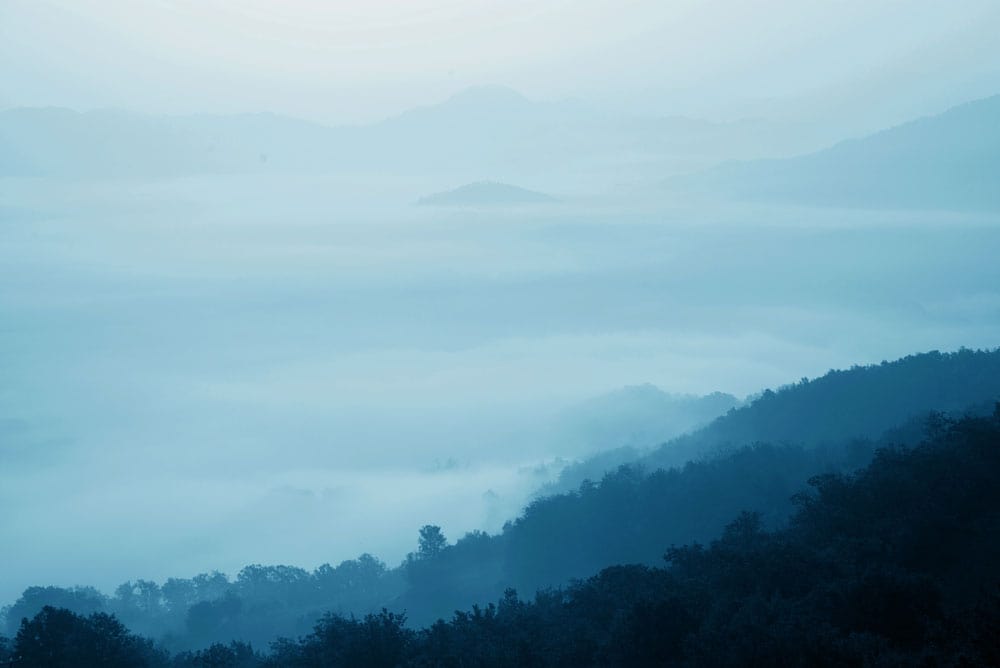 Wallpaper Mural with Ombre Clouds and Hilltop Scenery for Home Decoration