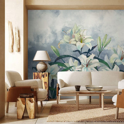 Elegant wallpaper mural with watercolour lilies on a misty blue background, modern living room setting.