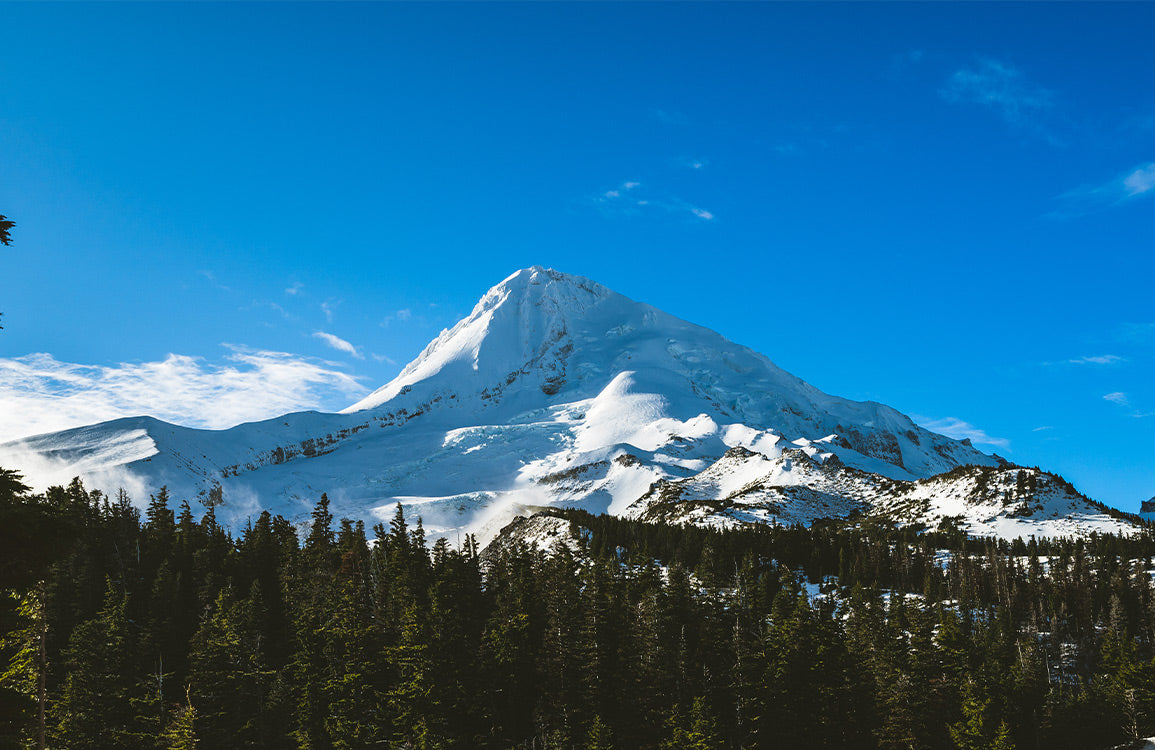 Papier Peint Panoramique au Sommet d'une Montagne enneigée