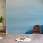 Decorate your living room with this ombre cloud and hilltop wallpaper mural.