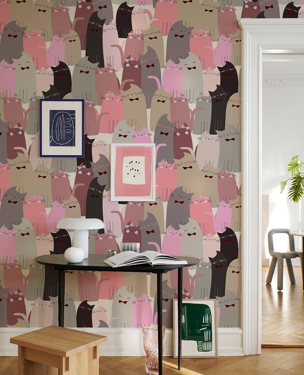 wallpaper made to order for the client's home office, with a repetitive pattern of pink cat couples