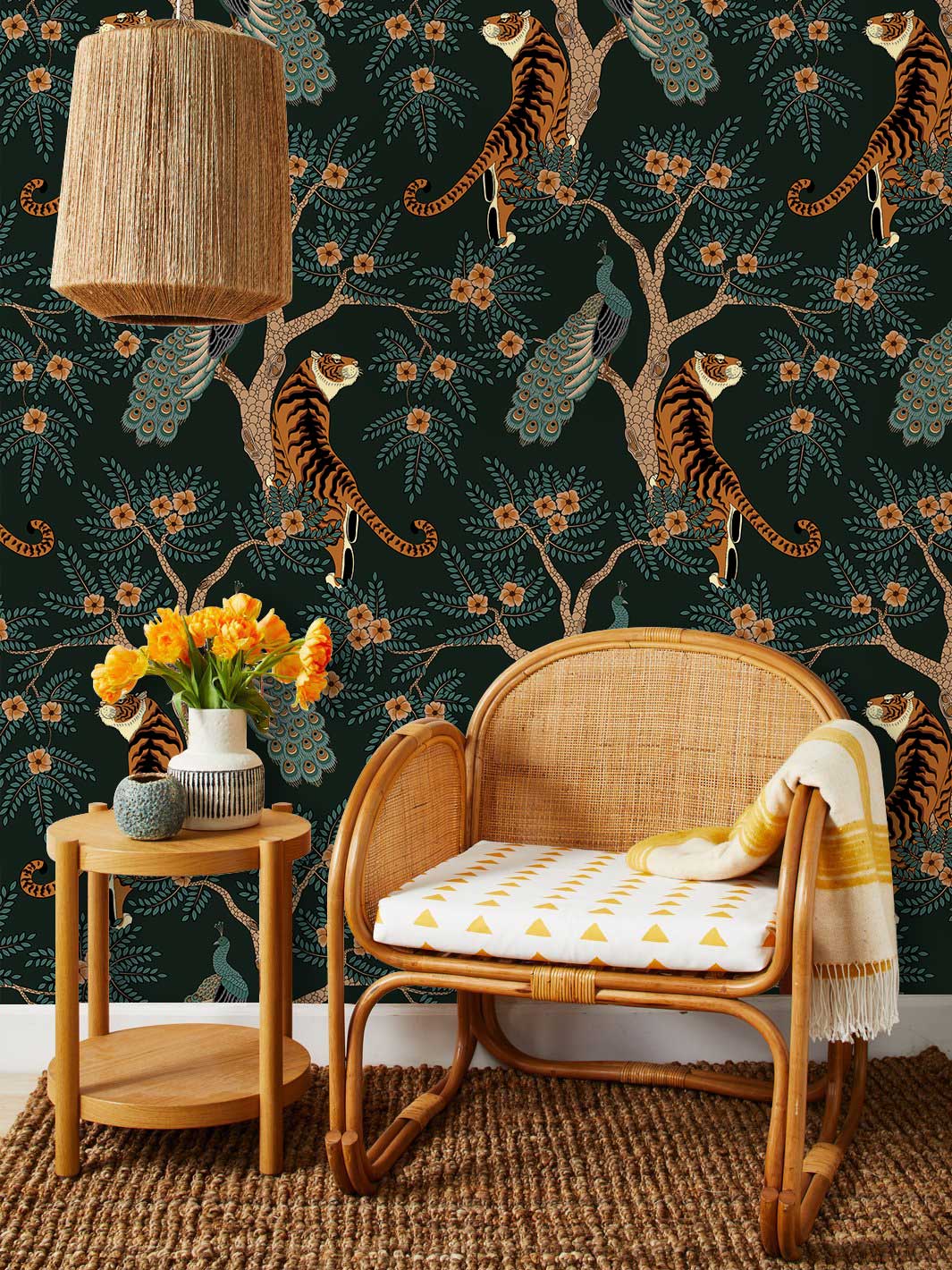 Elegant dark green jungle wallpaper in living room with wicker chair, wooden table, natural decor.