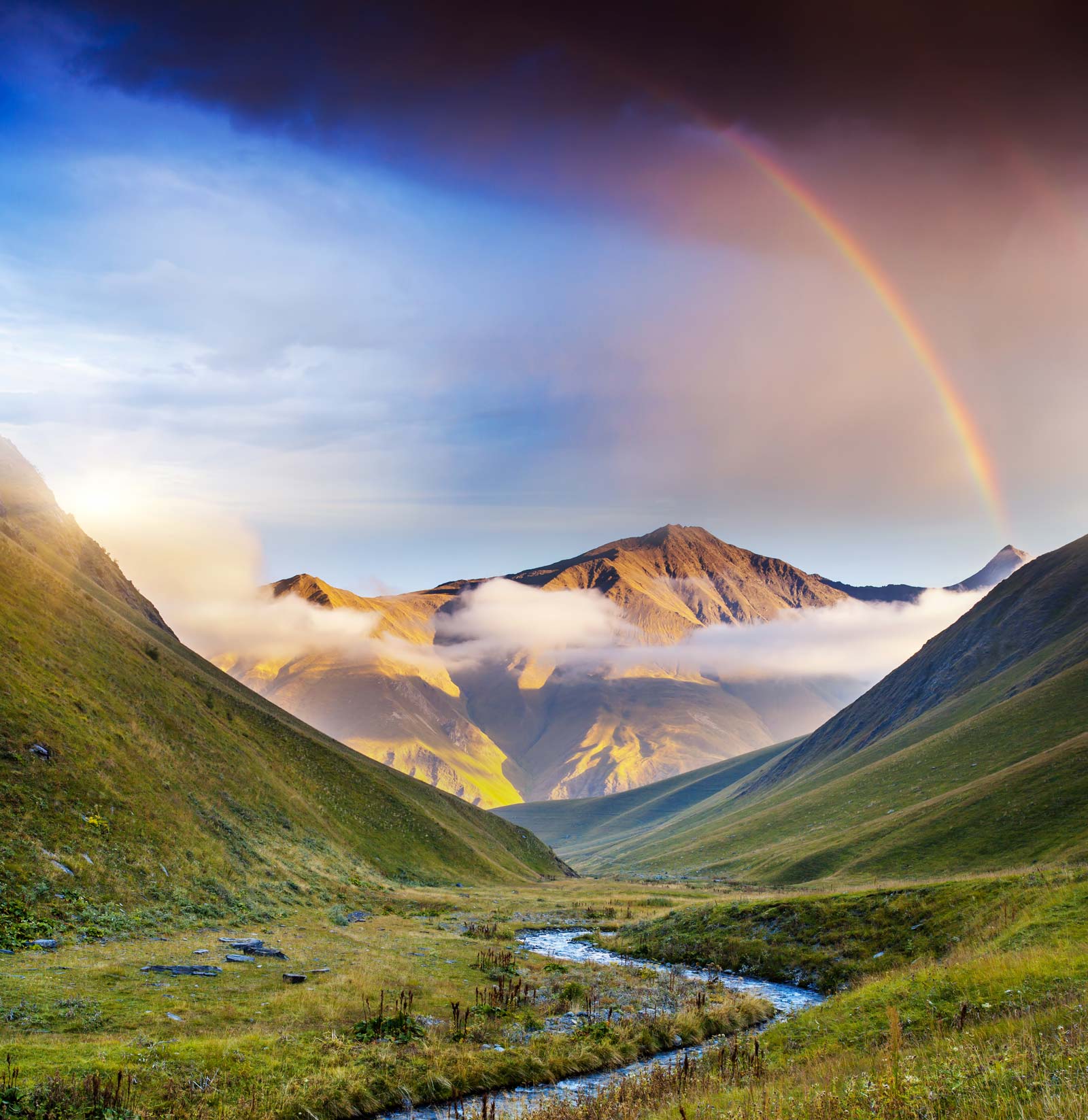 Wallpaper mural of a valley rainbow for use in interior design.