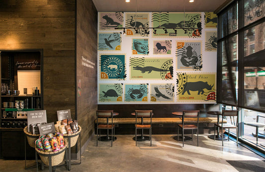 Vintage Animal Stamp Collection Mural Wallpaper in coffee shop.