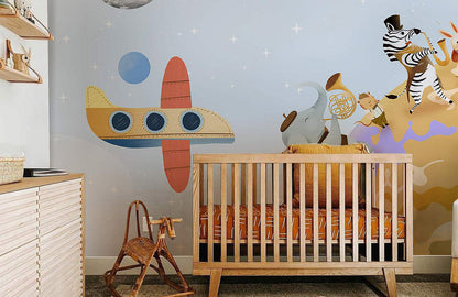 Wallpaper mural with roaming animals from the universe for the nursery.