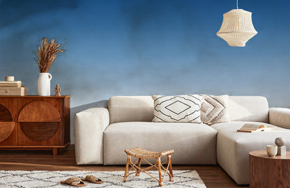 Wallpaper mural with a blue ombre gradient design for use as home decor.
