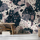 The room features a marble and fragments pattern on the wallpaper mural.