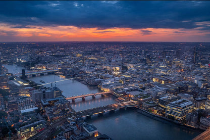 Wallpaper mural featuring a scene of London at sunset, perfect for decorating your home.