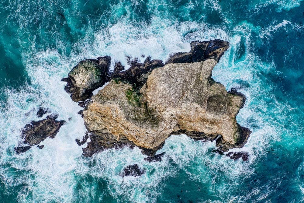 Aerial Ocean Waves Rock Mural Wallpaper