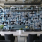 Wallpaper mural with black and blue squares, ideal for use in an office setting.