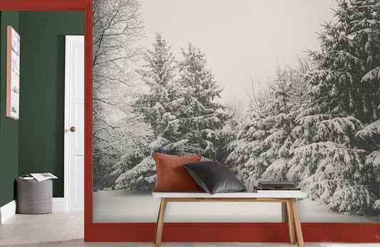 Wallpaper mural depicting a snowy forest scene in gray, ideal for use in hallway decor