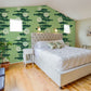 Wallpaper mural with a green lotus line design for use in decorating a bedroom