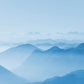 Wallpaper mural for home decoration featuring a light mist enveloping mountains.