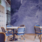 Mural wallpaper featuring an old-fashioned paint job in a deep purple colour for the dining room.