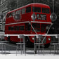 Wallpaper mural with a red double-decker bus scene for use as office decor