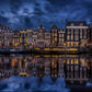 Amsterdam city by shore in dark and its relection in lake wallpaper design art