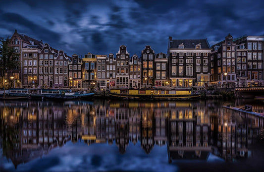 Amsterdam city by shore in dark and its relection in lake wallpaper design art