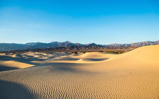 steady desert and mountains under blue sky custom wallpaper