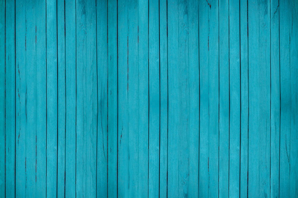 Turquoise wallpaper murals with a wood feel and subtle cracks.