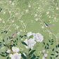blossoms on branches and big floral wall paintings adorn the green backdrop.