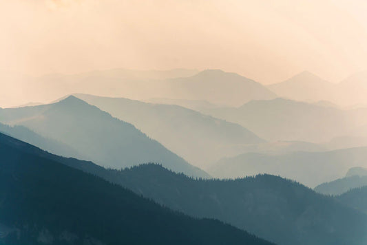 mountain peaks in heavy clouds wallpaper mural