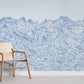 a wall painting with sketched mountain peaks