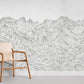 a wall painting with sketched mountain peaks