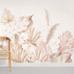 a pink wallpaper mural with a variety of watercolors leaves