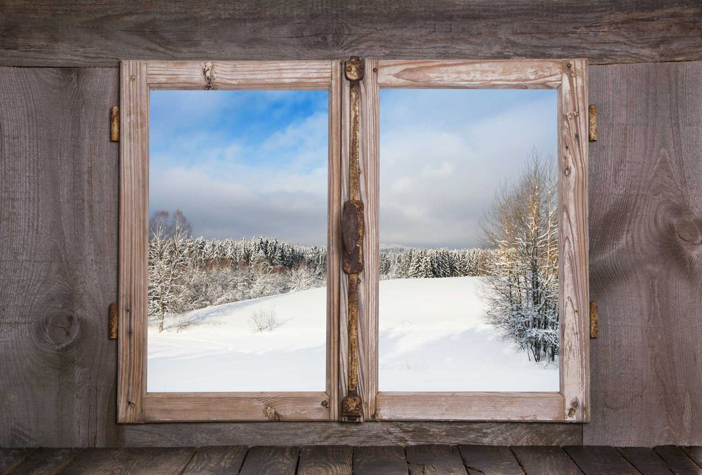 Wallpaper mural depicting a wintry snow woodland for use in interior decoration