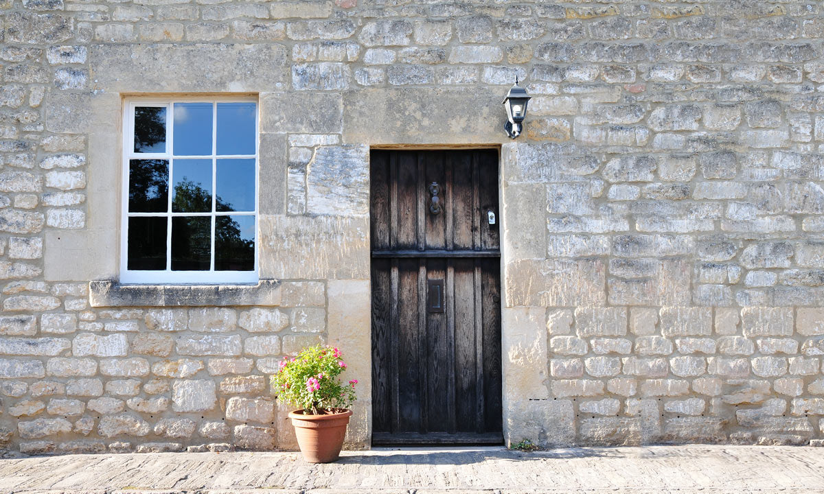 Plain Wallpaper Mural Featuring a Stone and Concrete House