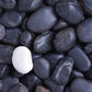 Home Decoration Wallpaper Mural Featuring a White Pebble Set in a Field of Black Pebbles