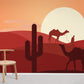 Wallpaper mural for home decoration with a sunset over a cactus desert.