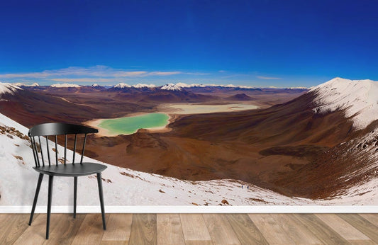 Wallpaper mural of a lake surrounded by snow-capped mountains