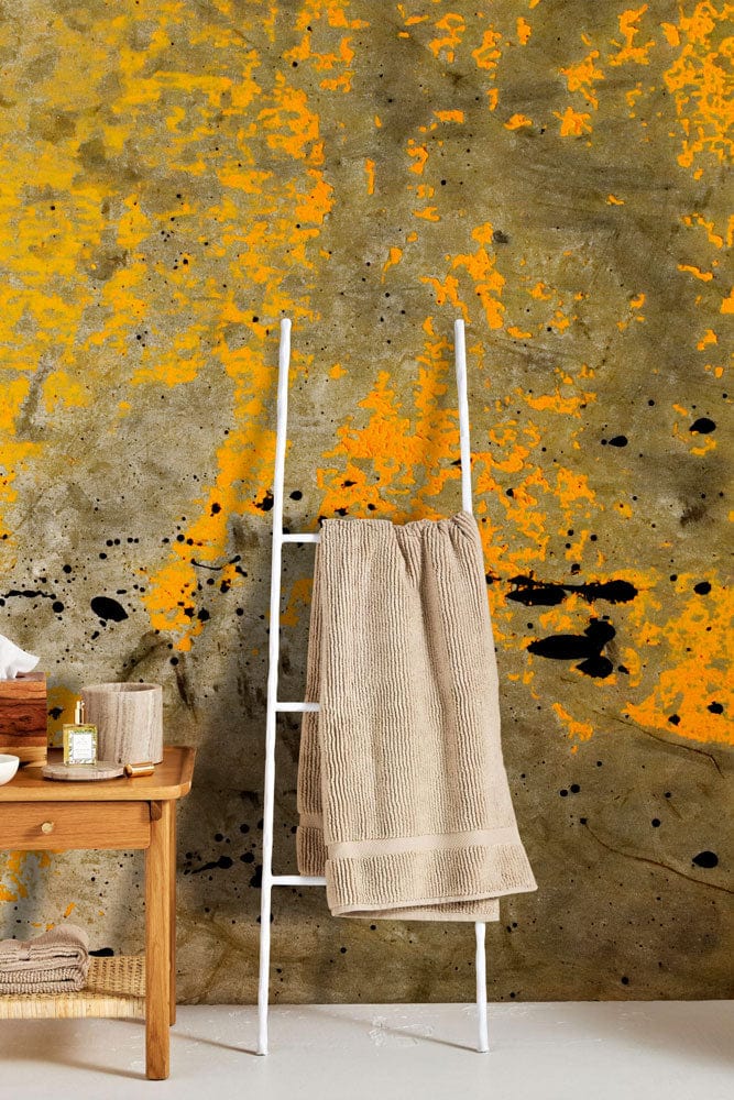 Wallpaper mural featuring an aged yellow paint finish, perfect for use in the bathroom.